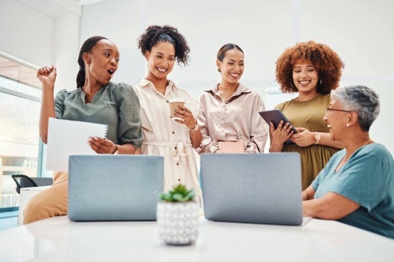 Laptop, meeting and business women in office in discussion for teamwork brainstorming. Collaboratio